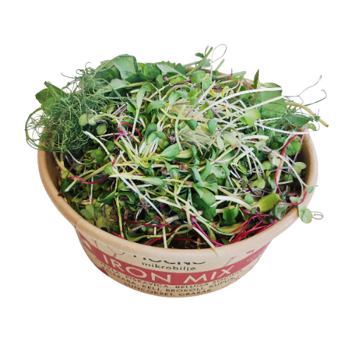 Open tub of MOĆNO Iron Mix fresh microgreens, close-up