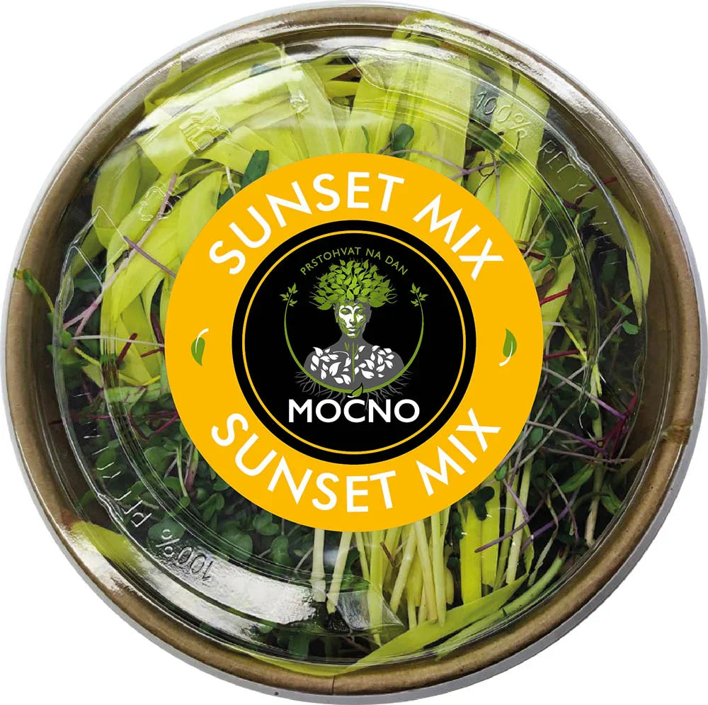 Shot of the Sunset Mix lid from above. The focus is on the yellow label design with the MOĆNO logo and written ingredients: sunflower, corn, beetroot, red chard, china rose and sango radish, and coriander.