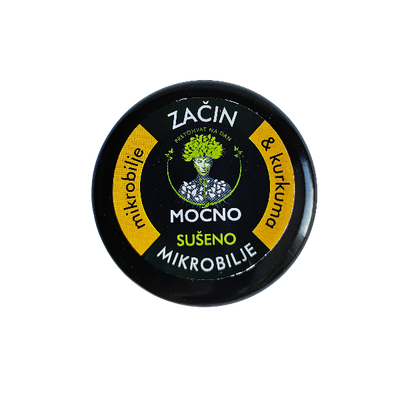 Shot of the jar lid from above. The focus is on the black label with a yellow circle and the recognizable MOĆNO logo that guarantees the premium quality of dried microgreens.
