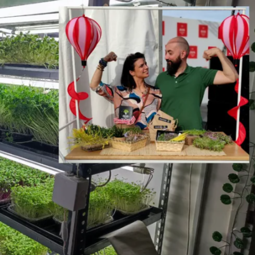 Milena and Ivan, founders of the MOĆNO brand, in a fun pose that symbolizes strength and vitality obtained from superfoods at their promotional stand.